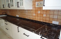 Black Marquina marble countertop in the kitchen interior