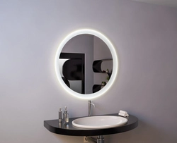 Round Mirror With Lighting In The Bathroom In The Interior
