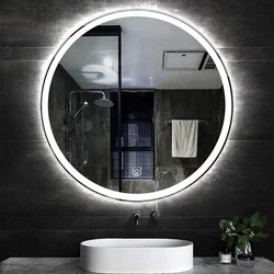 Round Mirror With Lighting In The Bathroom In The Interior