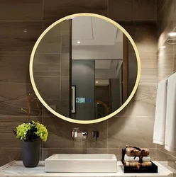 Round mirror with lighting in the bathroom in the interior