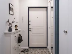 Door With A Mirror In The Interior Of A Small Entrance Hallway