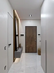 Door with a mirror in the interior of a small entrance hallway