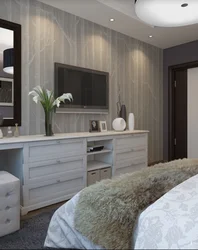 Bedroom design with chest of drawers and table