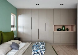 Bedroom design with a niche for a closet