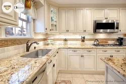 Wooden kitchen design with marble countertops
