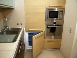 Kitchen design with microwave cabinet