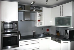 Corner kitchen design with refrigerator and microwave