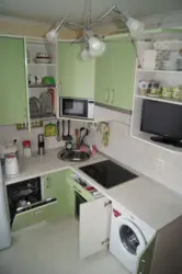 Corner kitchen design with refrigerator and microwave