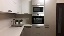 Corner Kitchen Design With Refrigerator And Microwave