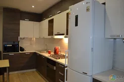 Corner kitchen design with refrigerator and microwave