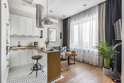 Design of a studio apartment with a kitchen by the window