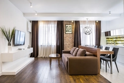 Design of a studio apartment with a kitchen by the window