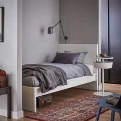 Bedroom design with a single bed against the wall