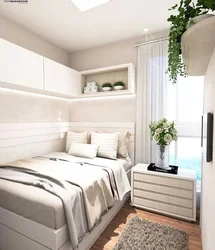 Bedroom Design With A Single Bed Against The Wall