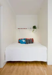Bedroom Design With A Single Bed Against The Wall