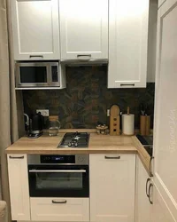 Small kitchen design with microwave and refrigerator