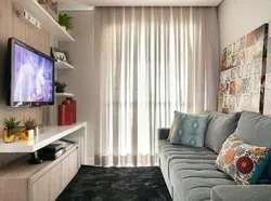 Дизайн гостиной с угловым диваном и телевизором