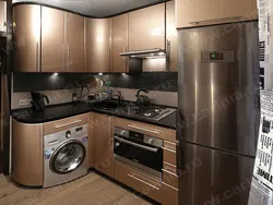 Kitchen With Design Gas Stove, Refrigerator And Microwave