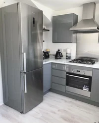 Kitchen with design gas stove, refrigerator and microwave