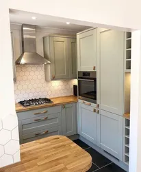 Kitchen design with a refrigerator in the corner by the window