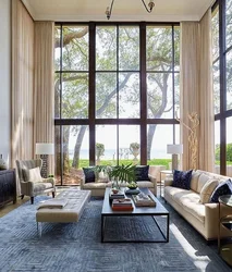 Living Room Design In A Country House With Large Windows