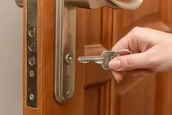 Photo of apartment door with keys