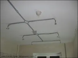 Wiring suspended ceiling along the ceiling in an apartment photo