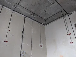 Wiring suspended ceiling along the ceiling in an apartment photo