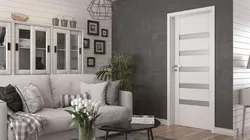 Doors in the interior of an apartment with gray floors