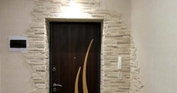 Stone decoration of the entrance door in the apartment photo