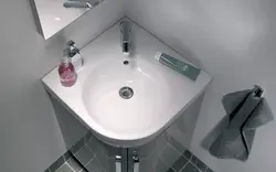 Corner sink with mirror for bathroom photo
