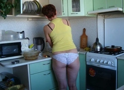 Photo of my mom at home in the kitchen