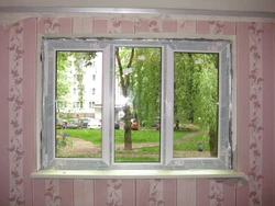 Photo of a plastic window for the kitchen with installation