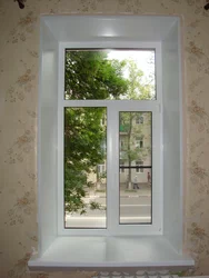 Photo of a plastic window for the kitchen with installation