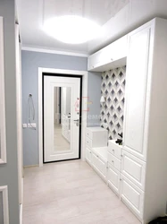 White hallway with mirror photo