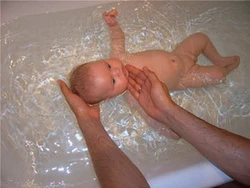 Photo of a newborn in the bath