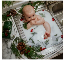 Photo of a newborn in the bath
