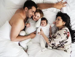 Photo Of Family In Bedroom