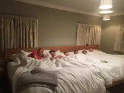 Photo of family in bedroom