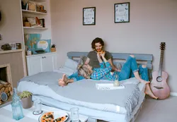 Photo of family in bedroom