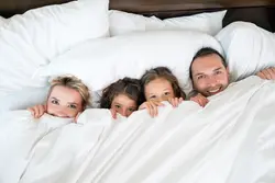 Photo of family in bedroom