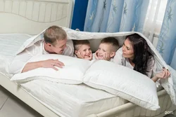 Photo of family in bedroom