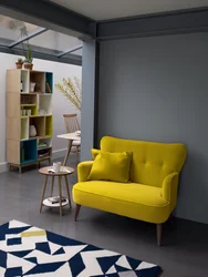 Yellow armchair in the bedroom interior