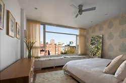 Bedroom design with a window in the center