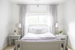 Bedroom design with a window in the center