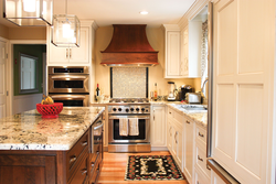 Kitchen design with hood in the corner