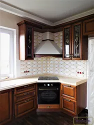 Kitchen design with hood in the corner