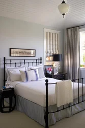 Bedroom design with white metal bed