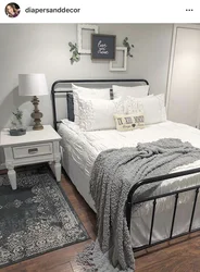 Bedroom design with white metal bed