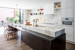 White kitchen design with marble countertops